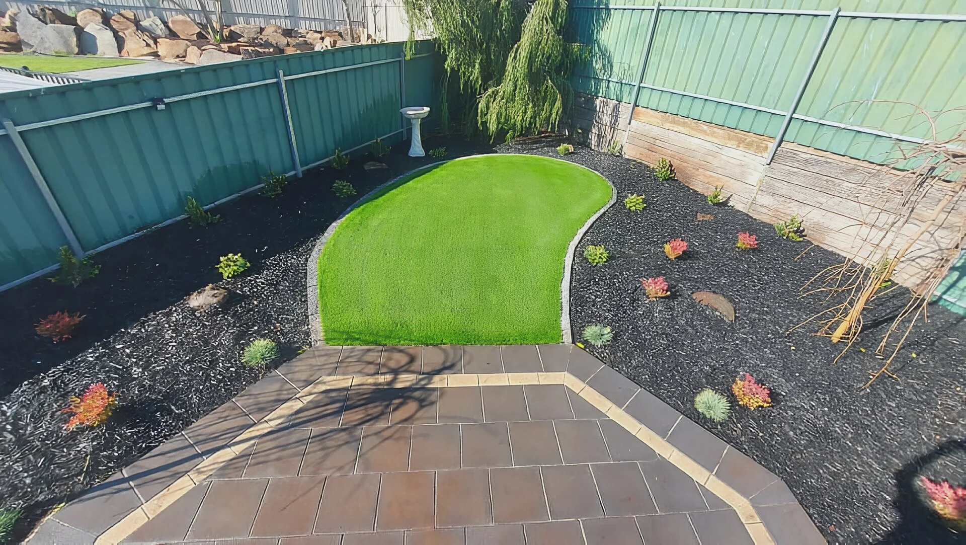 Multi-service yard build with retaining, lawn and paving